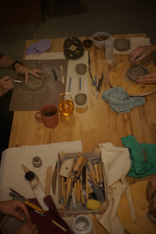 Close-up of clay being worked by hand in the studio