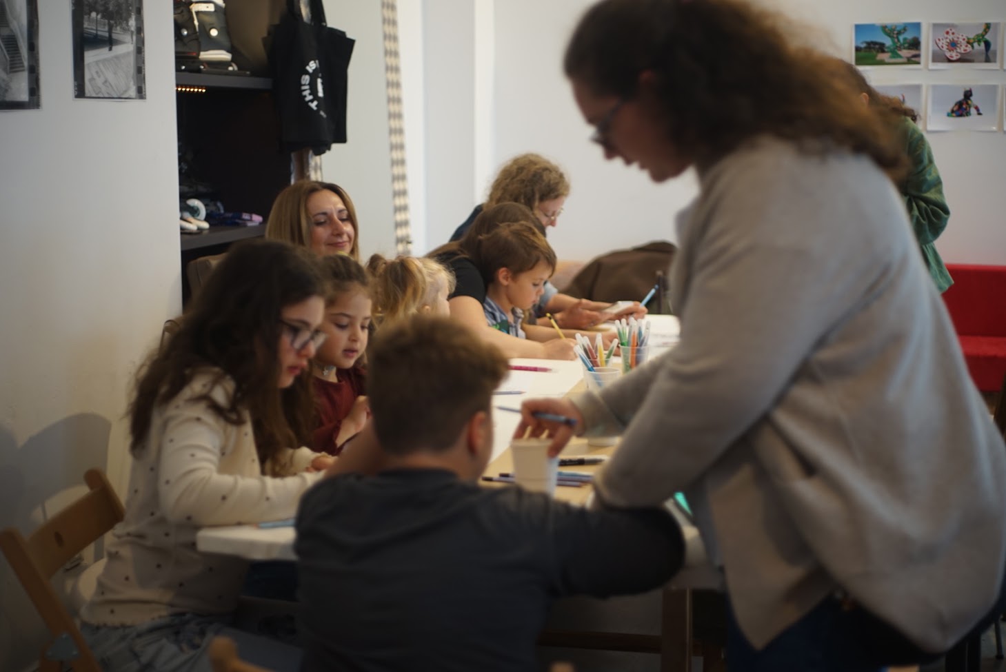 Kids focused on their artwork in the studio space