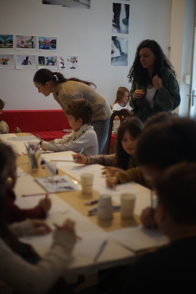 Finished artworks and happy faces at the end of the workshop