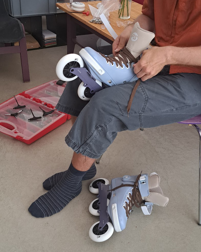 Fitting a new pair of skates at the workbench